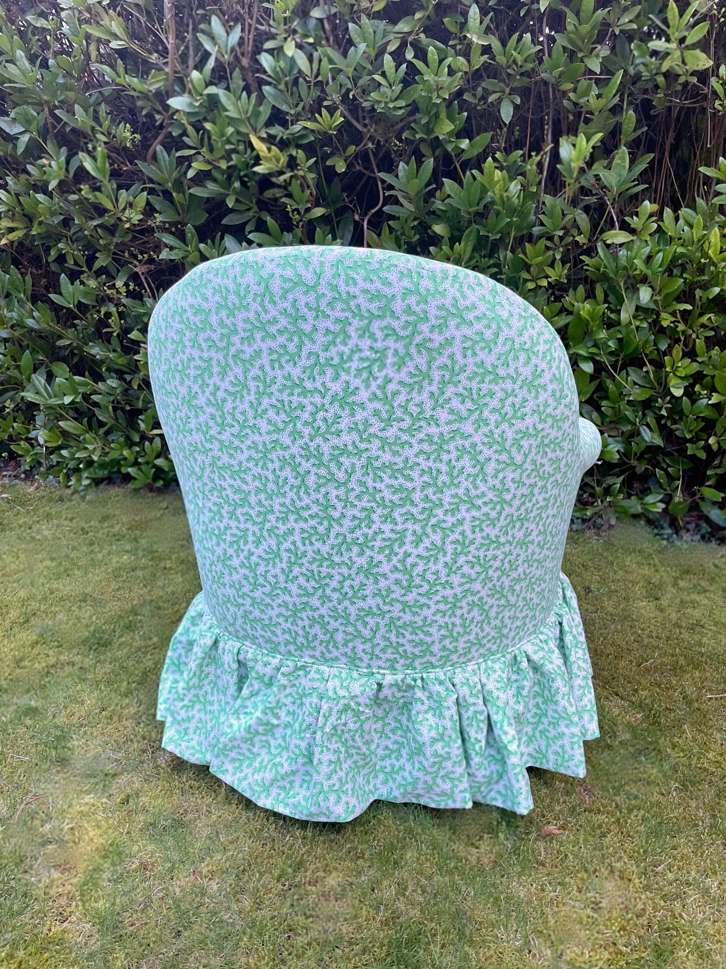 Schumacher ‘Sea Coral’ skirted armchair