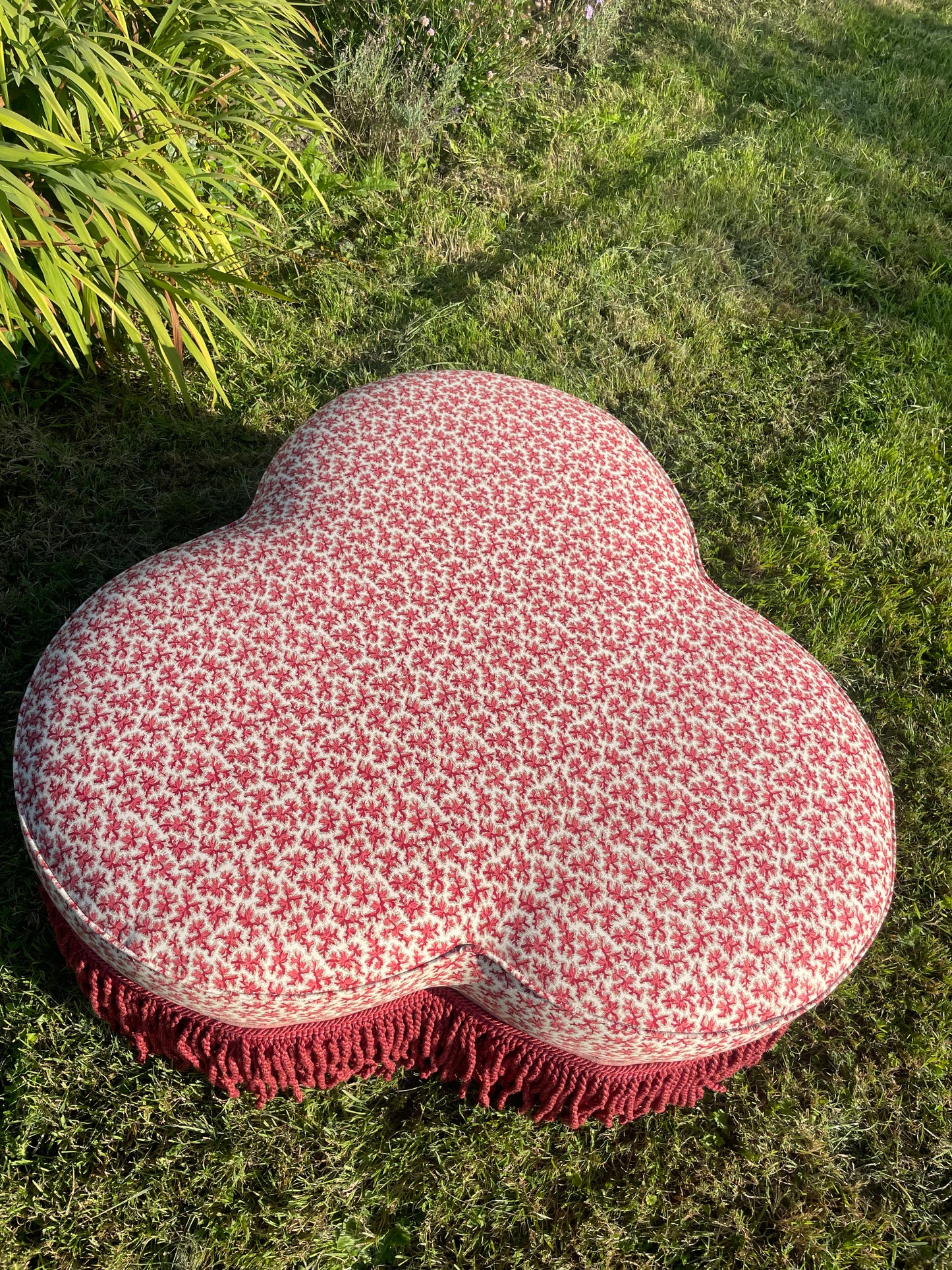 Trefoil ottoman footstool in Colefax Oak Twig