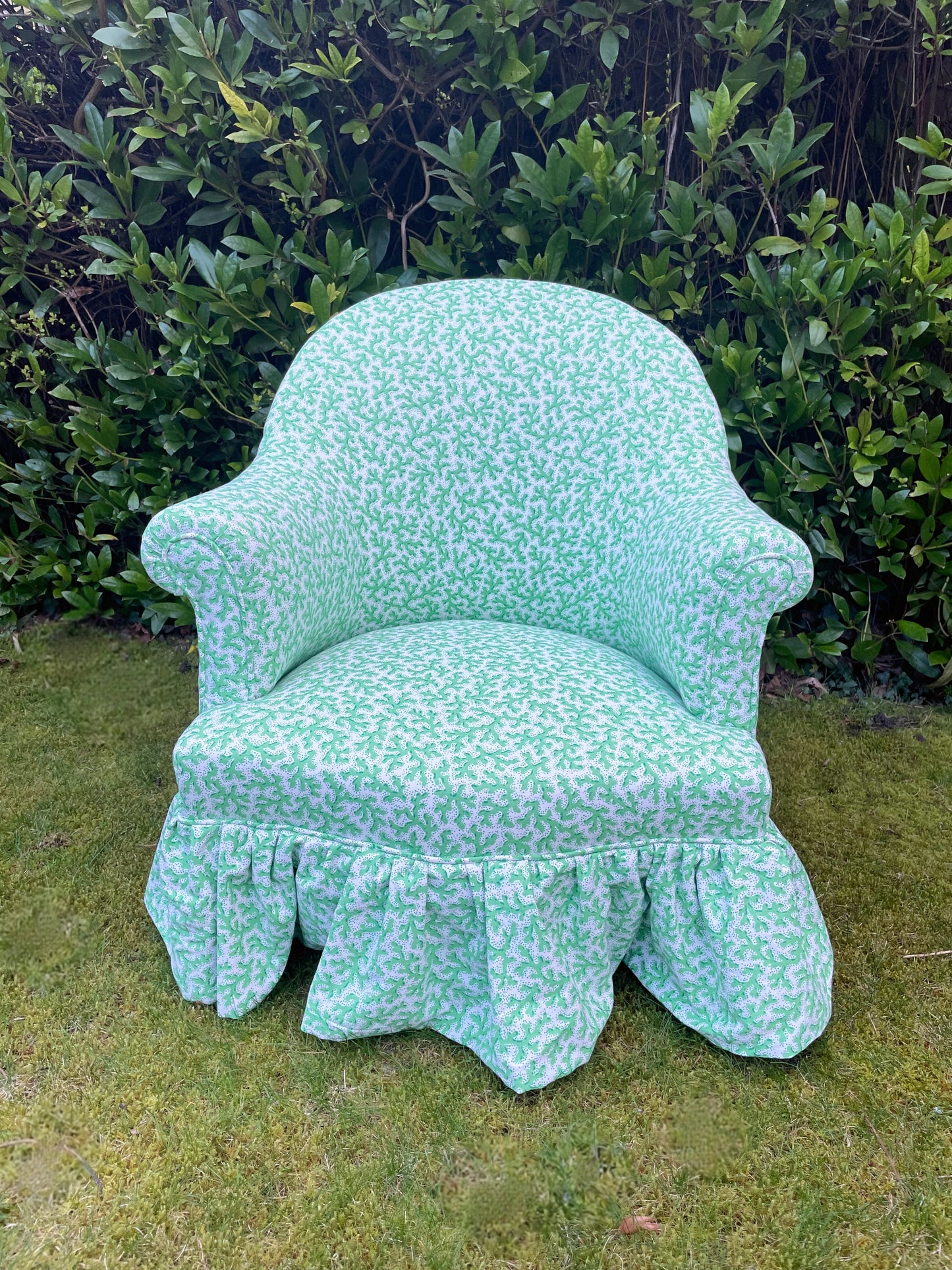 Schumacher ‘Sea Coral’ skirted armchair