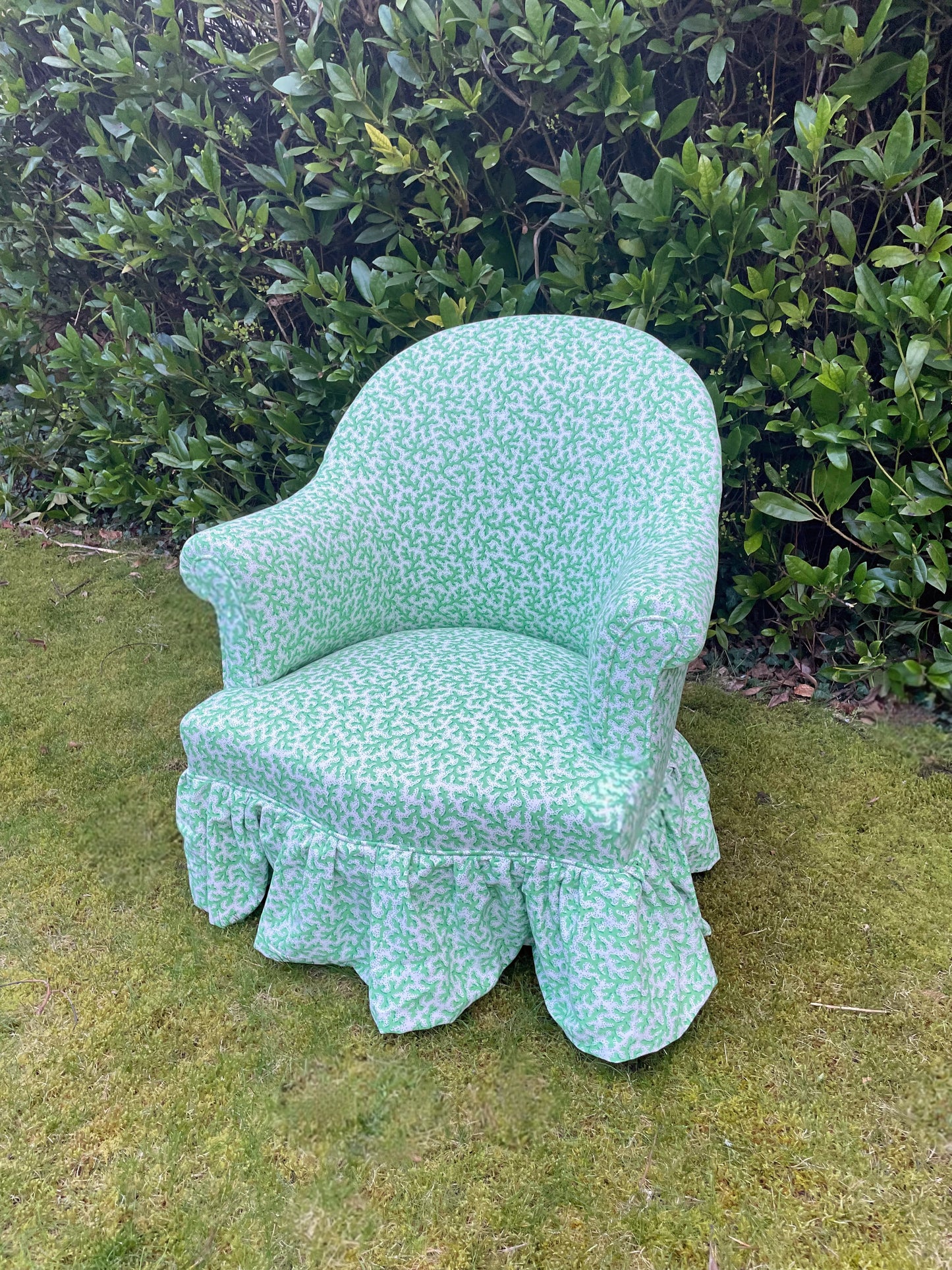 Schumacher ‘Sea Coral’ skirted armchair