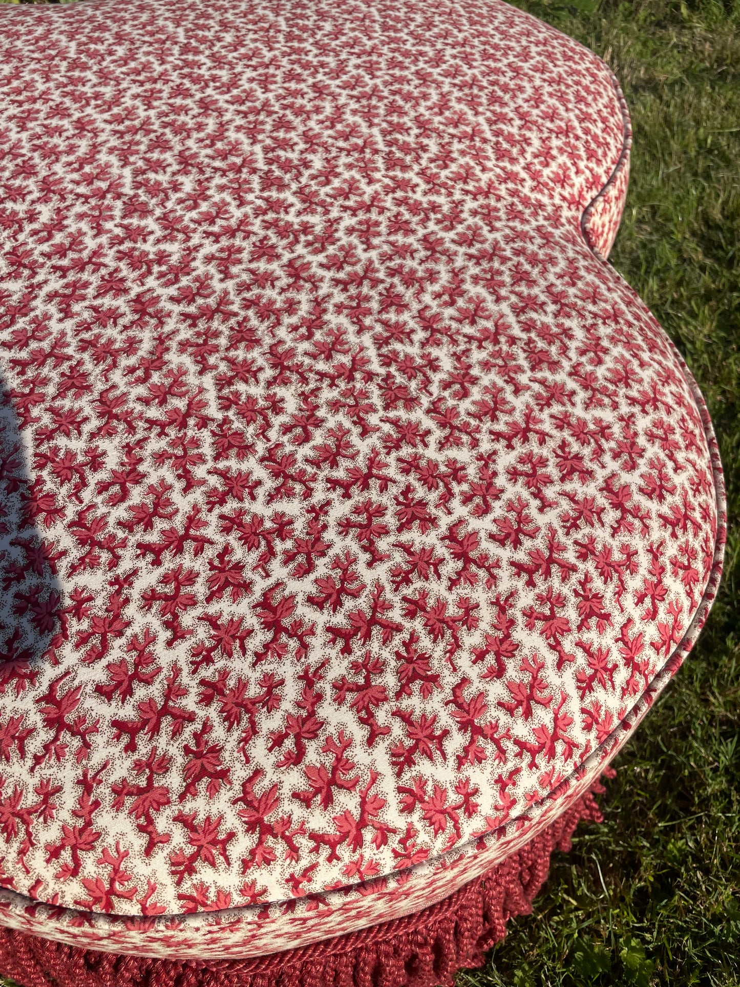 Trefoil ottoman footstool in Colefax Oak Twig