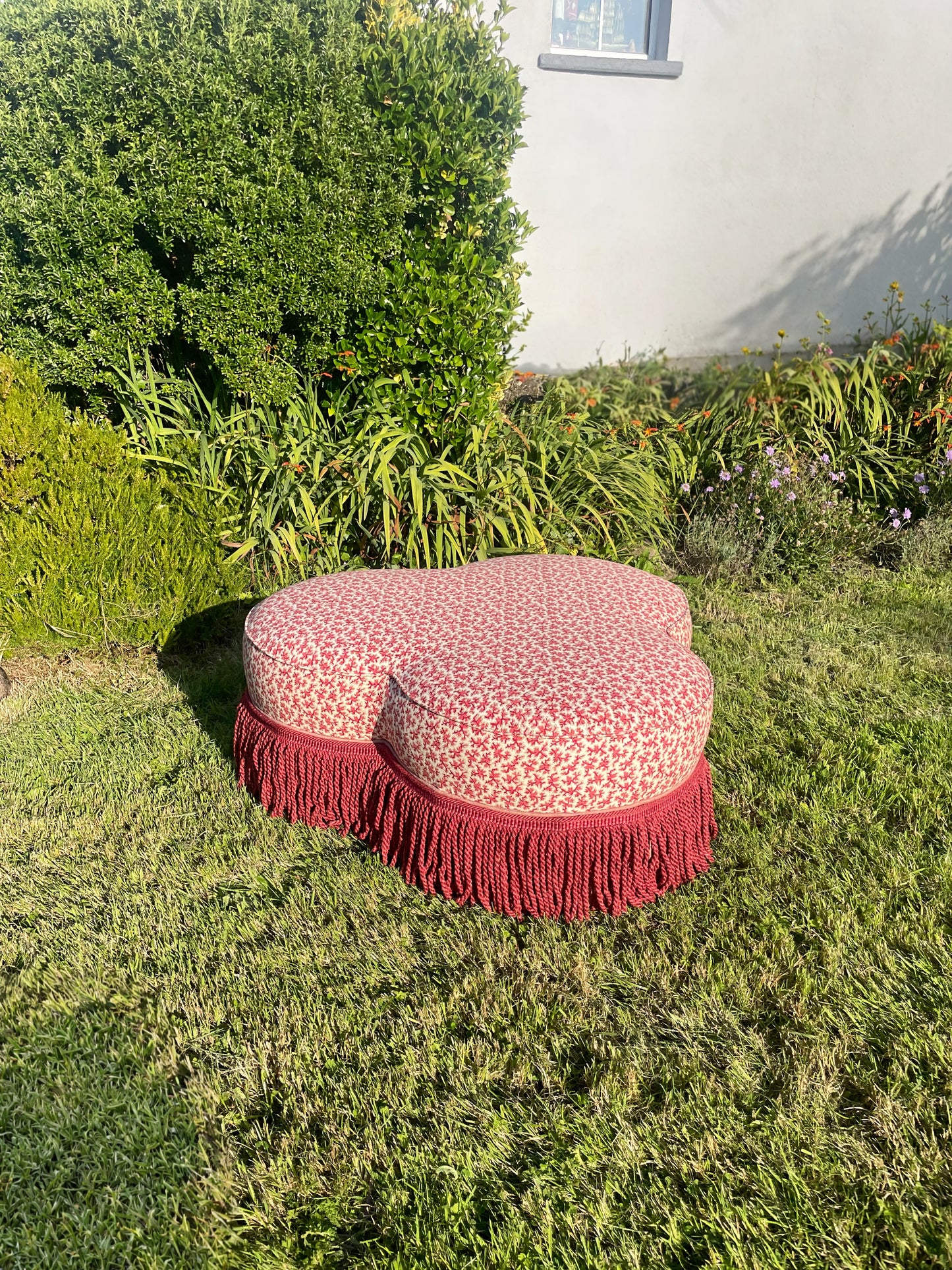 Trefoil ottoman footstool in Colefax Oak Twig