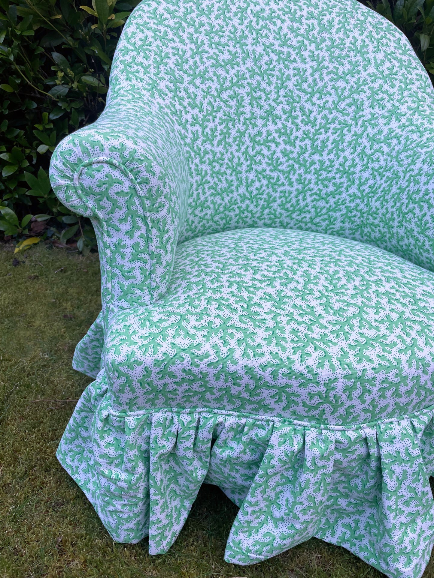 Schumacher ‘Sea Coral’ skirted armchair