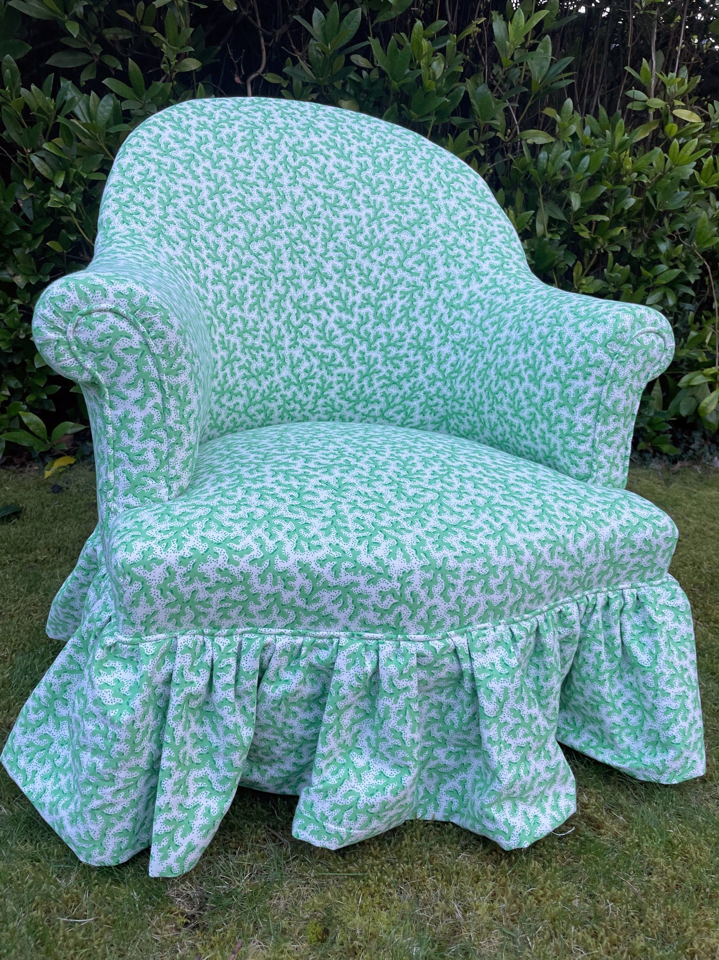 Schumacher ‘Sea Coral’ skirted armchair